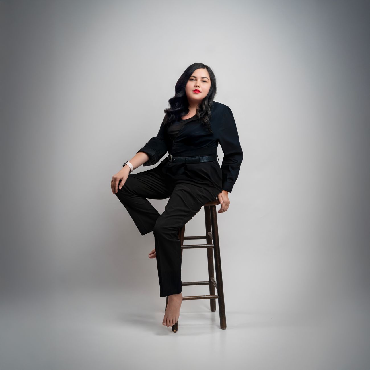 portrait of professional skin therapist with calm expression in minimalist studio setting